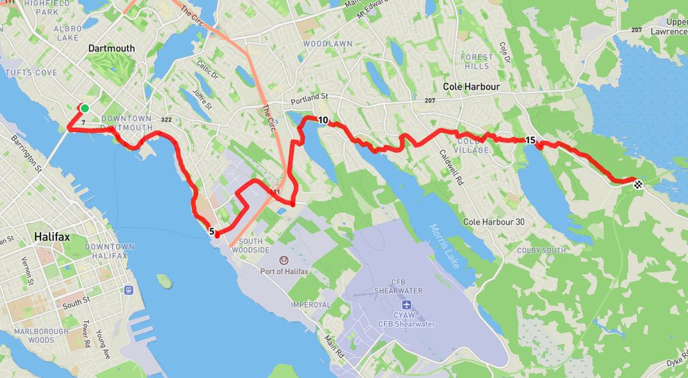 A coloured map of Halifax, Dartmouth and Cole Harbour showing a red route that winds around several lakes. 
