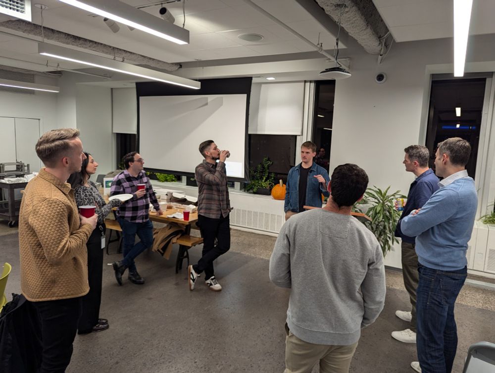 Meetup participants chatting with John Rudolph Drexler after his talk