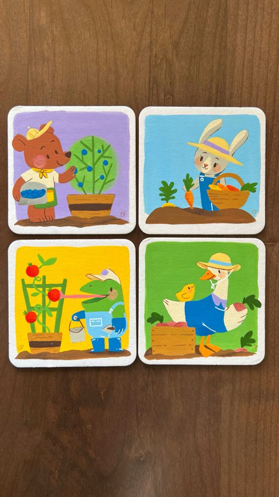 Colorful artwork on 4x4” coasters featuring animals gardening. 