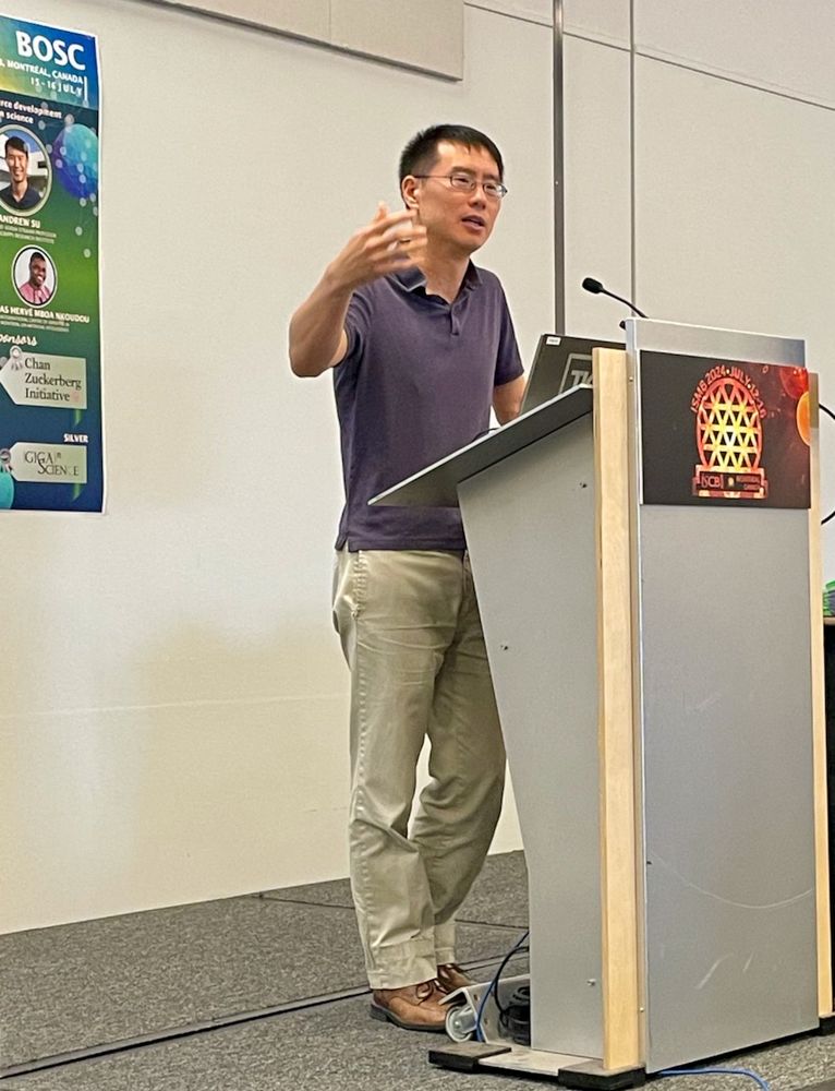 BOSC 2024 keynote speaker Andrew Su at the podium