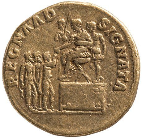 Reverse of a Roman aureus: Trajan seated left on low platform, right with two attendants; three kings standing right before.