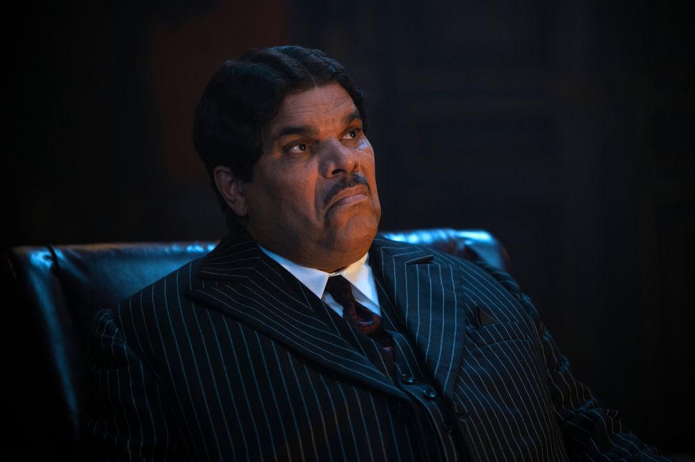 Still image of the TV show Wednesday, showing Luis Guzman as Gomez Addams.