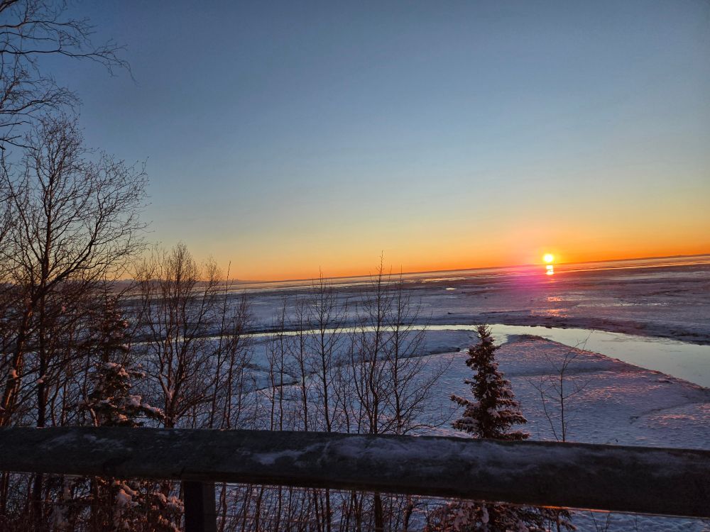 View of the sun setting over the mud flats