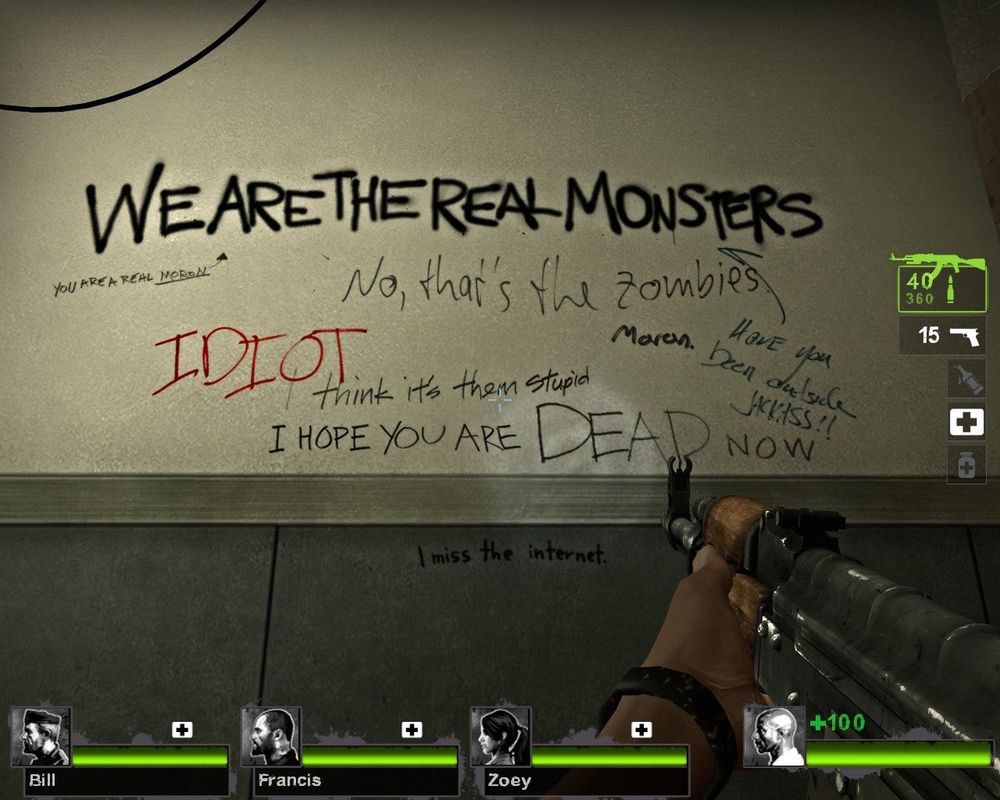 left 4 dead screenshot showing graffiti that reads "WE ARE THE REAL MONSTERS" followed by later graffiti insulting the person who wrote it