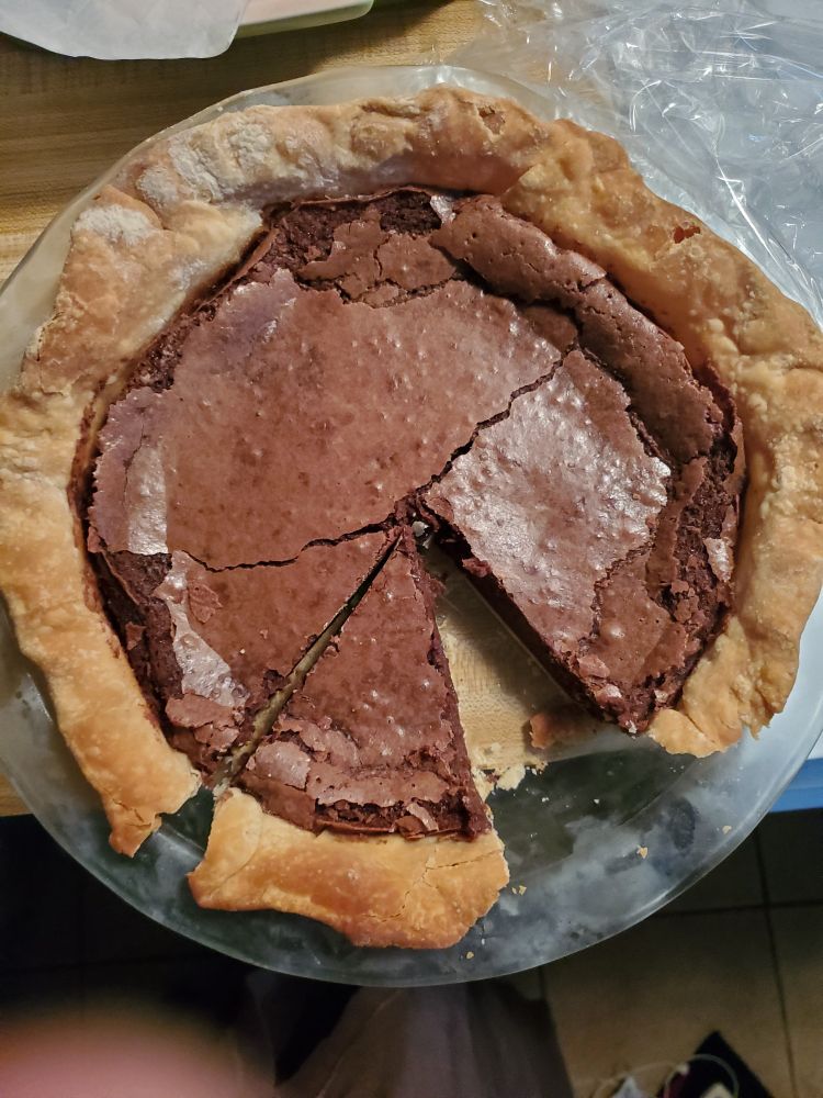 Chocolate pie with a slice missing. 