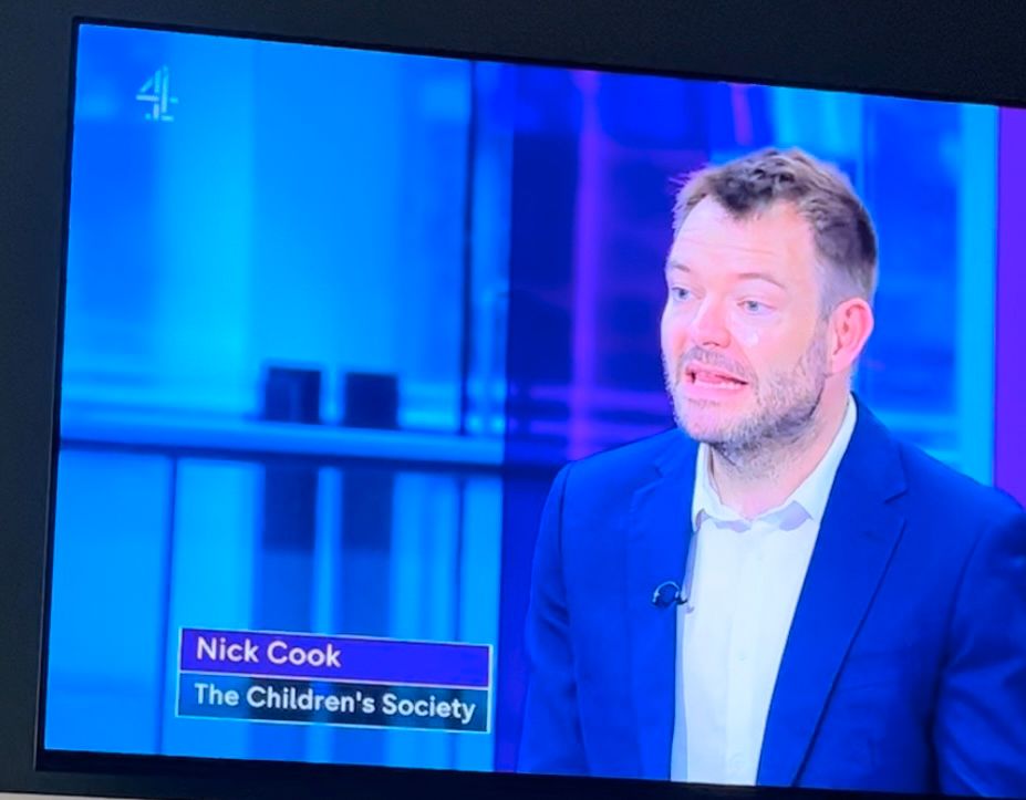 Screen shot of man talking on the TV. He is speaking.
On bottom left are the words “Nick Cook The Children’s Society” too right small image of a 4 