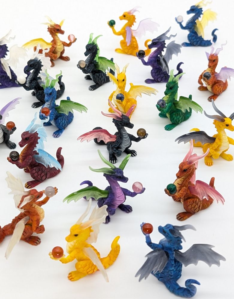 A flock of colourful dragon sculptures.