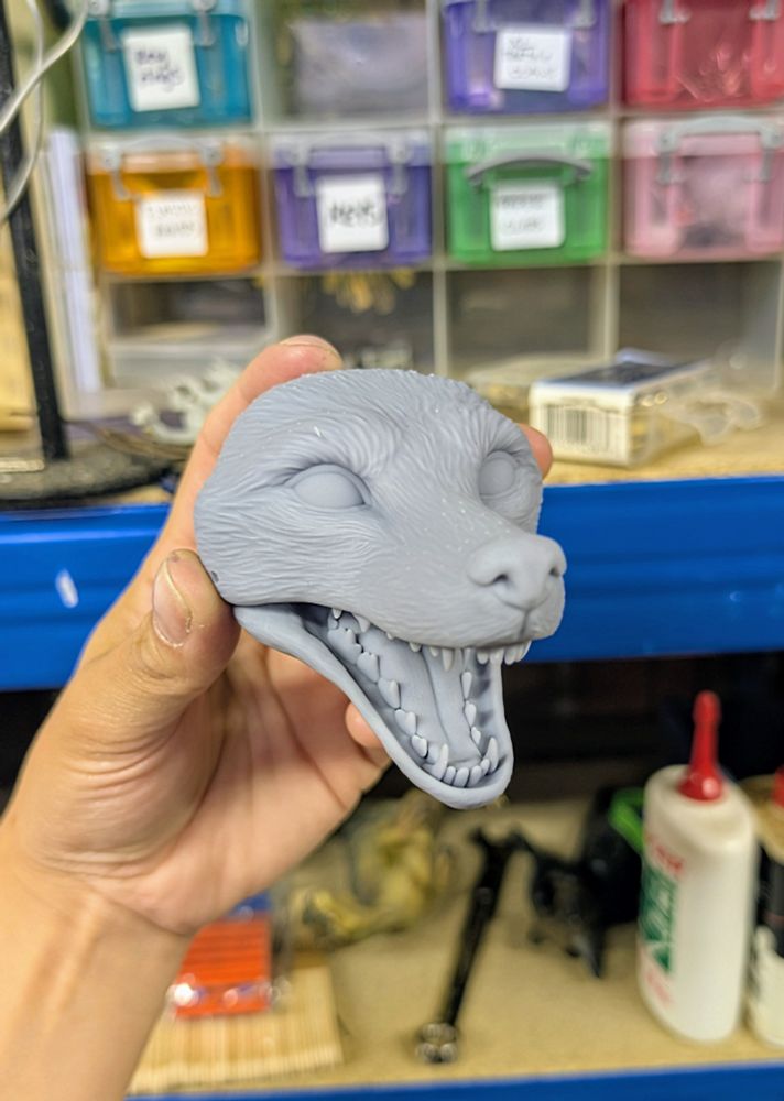 A grey, 3D printed fox doll head