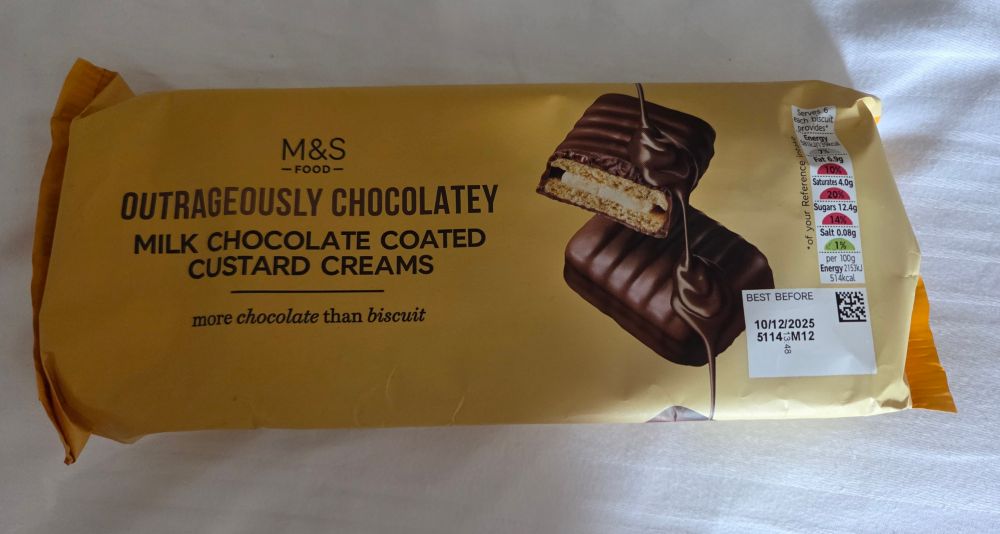 A packet of Marks & Spencer's Outrageously Chocolatey milk chocolate coated custard creams.
(Whch are all mine.)