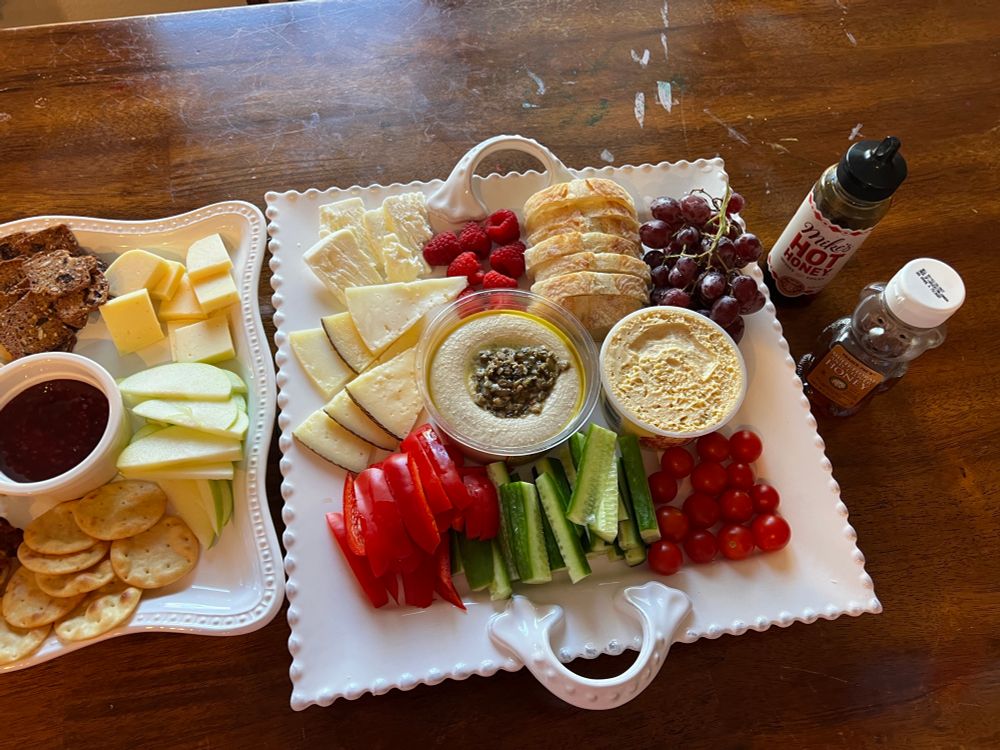 Sliced veggies, cheese, fruit, hummus 