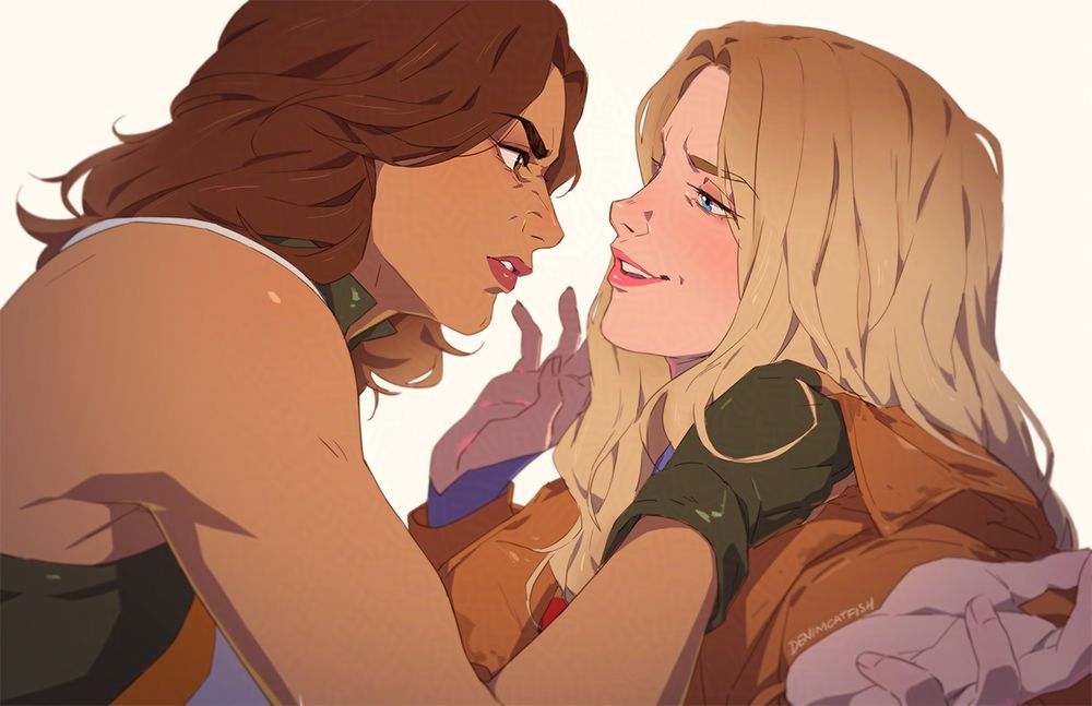 A frustrated Hawkgirl holding Supergirl by her collar. Supergirl looking very smug and feigning surrender.