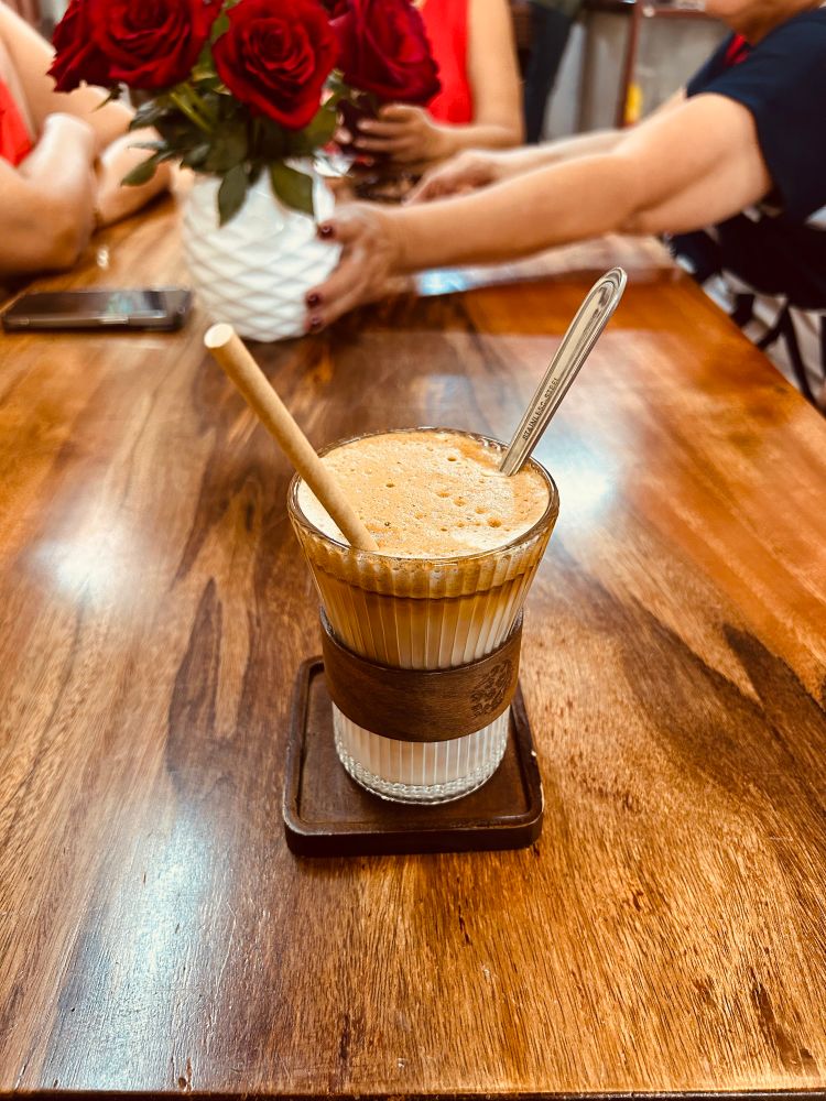 A glass of hot coconut coffee