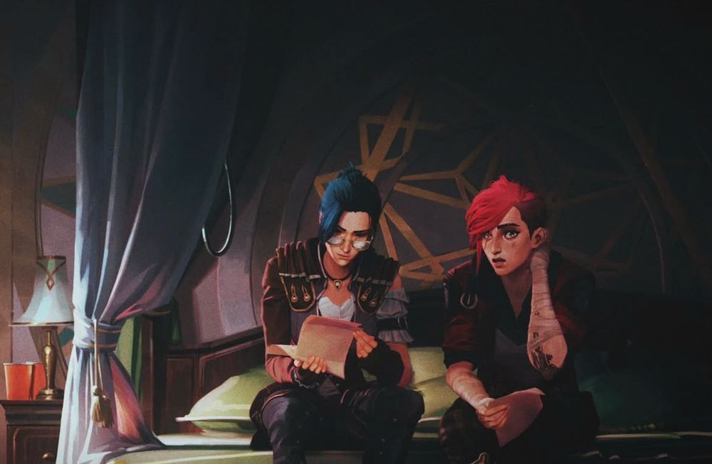 caitlyn and vi from a behind the scenes release from fortiche. caitlyn is wearing glasses and flipping through pages while vi sits with her hand at her neck. they’re in caitlyn’s bedroom from season 1