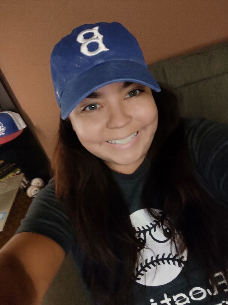 The brunette author of this post in a Brooklyn Dodgers hat she got at Dodger Stadium 