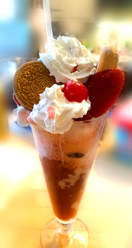 Soda parfait with cherry, strawberry, chocolate pretzel oreo, lady fingers, cherry soda, whipped cream, vanilla pudding