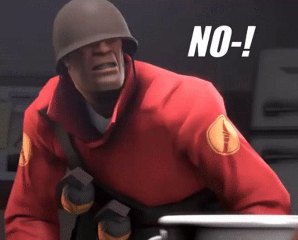 a man wearing a helmet and a red jacket has the word no on his chest