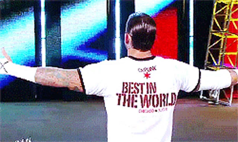 a man with his arms outstretched wearing a shirt that says best in the world