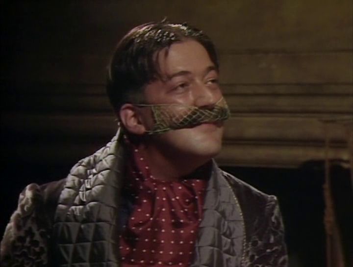 A picture of Stephen Fry as General Melchik wearing a stache net