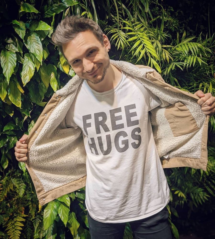 An image of me wearing a "free hugs" shirt.