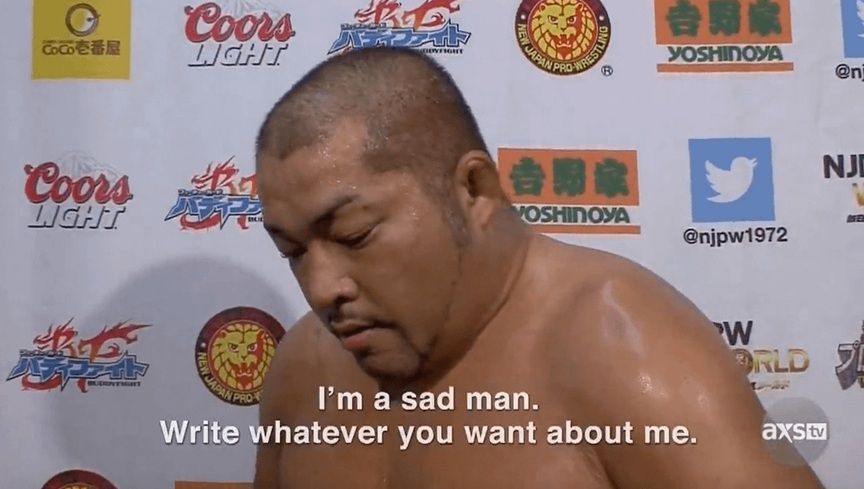 photo of a downtrodden Tomohiro Ishii in front of a sponsored backdrop

"I'm a sad man. Write whatever you want about me."