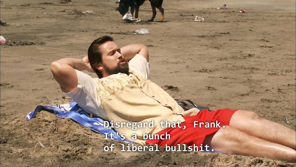 Screenshot of the show It’s Always Sunny in Philadelphia where Mac is in beach attire relaxing on the beach saying “Disregard that, Frank. it’s a bunch of liberal bullshit.”