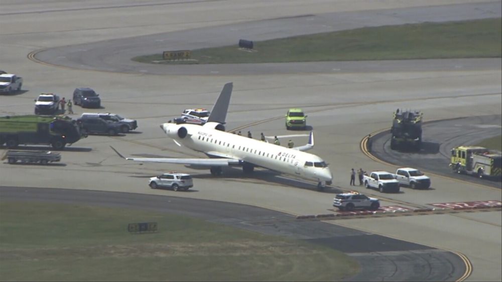 Two Delta planes collide on an Atlanta taxiway, knocking the tail off one