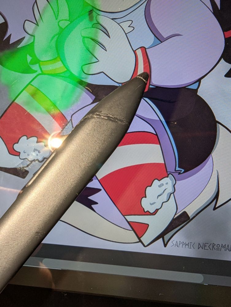 A tablet pen with a mended crack towards the tip 
