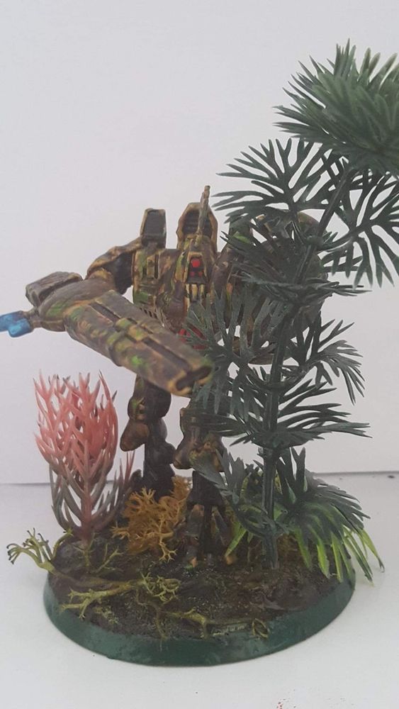 Tau commander in hazard suits painted in camo dpm pattern using fish tank plants as jungle foiliage