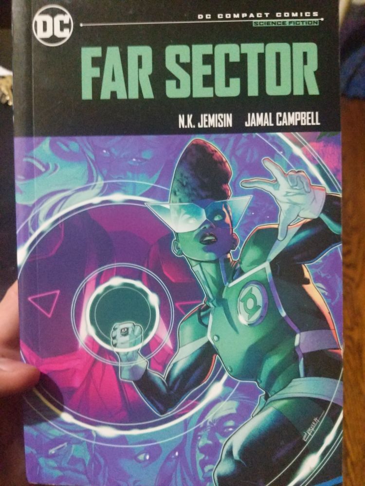 The cover to Far Sector 

Pretty green lantern lady using her ring. 
She's got awesome glasses, large triangle-ish that look like they could be powered by her ring 