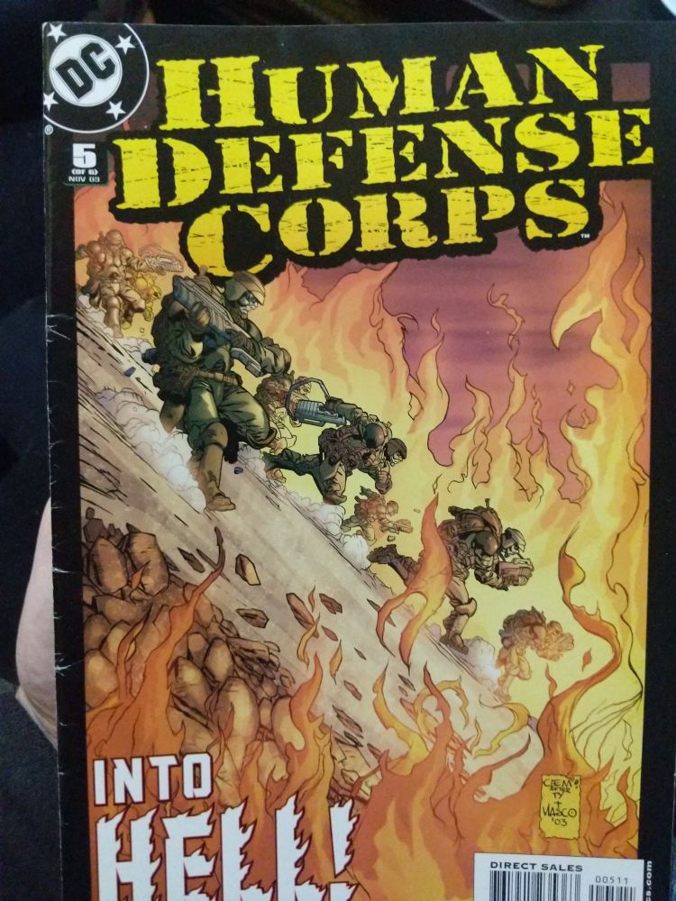 Military men run down a slope, as fire burns around them 
The text reads
"Into hell" 