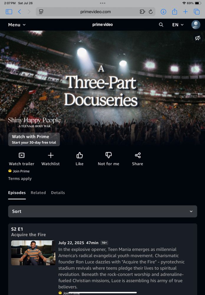 Screen shot for Amazon Prime series "Shiny Happy People" showing thousands of people in a stadium.