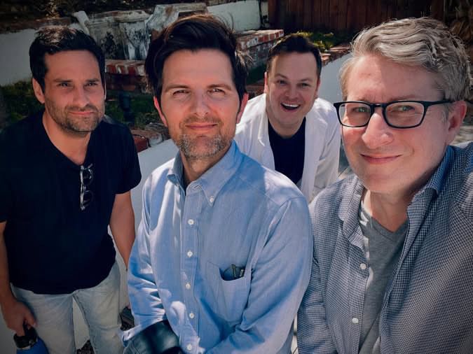 Scott and Scott, and Dan and Doug. Glasses are being worn, kept in a pocket, and hanging on a shirt! 