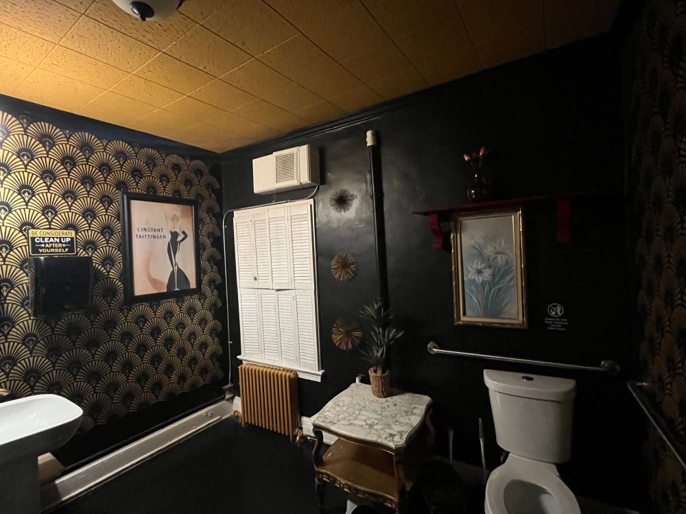 Low lit art deco style bathroom that was also freakishly giant. Found in Tarbender’s Lounge, Leesburg Virginia.
