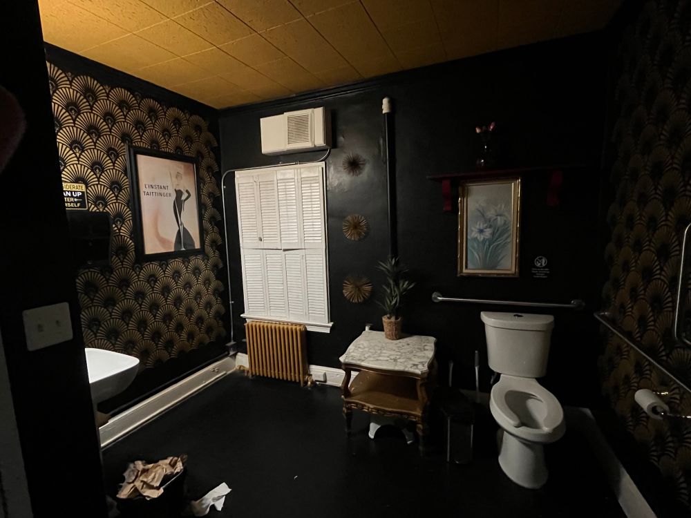 Low lit art deco style bathroom that was also freakishly giant. Found in Tarbender’s Lounge, Leesburg Virginia.