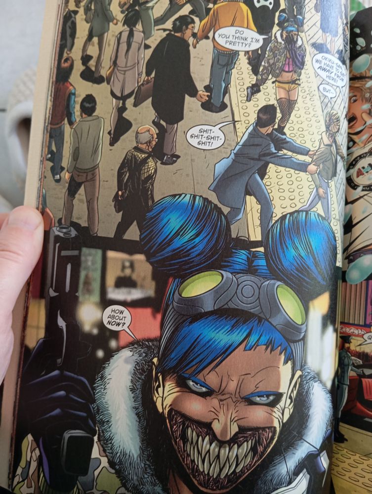 A page from a comic book: A woman in cyberpunk get-up asks if someone thinks she's pretty. Then she reveals that her face has been slit open and her teeth are deadly sharp.