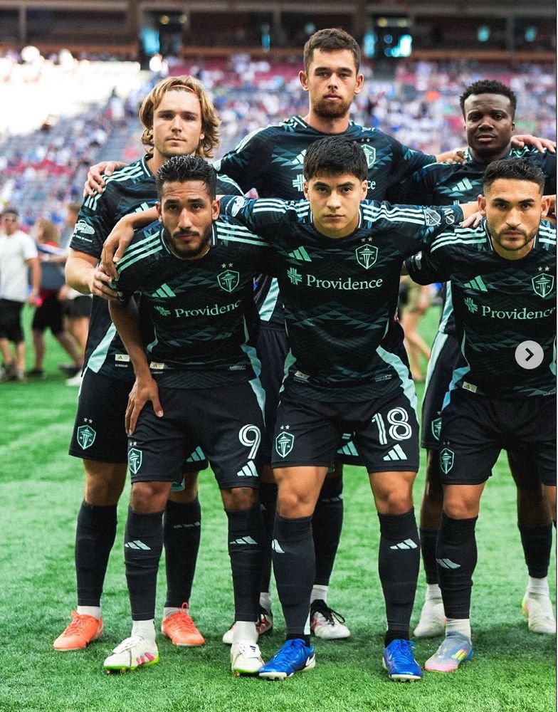 Several very good boys in the dark blue Salish Sea kit at Lumen Field before a recent match 