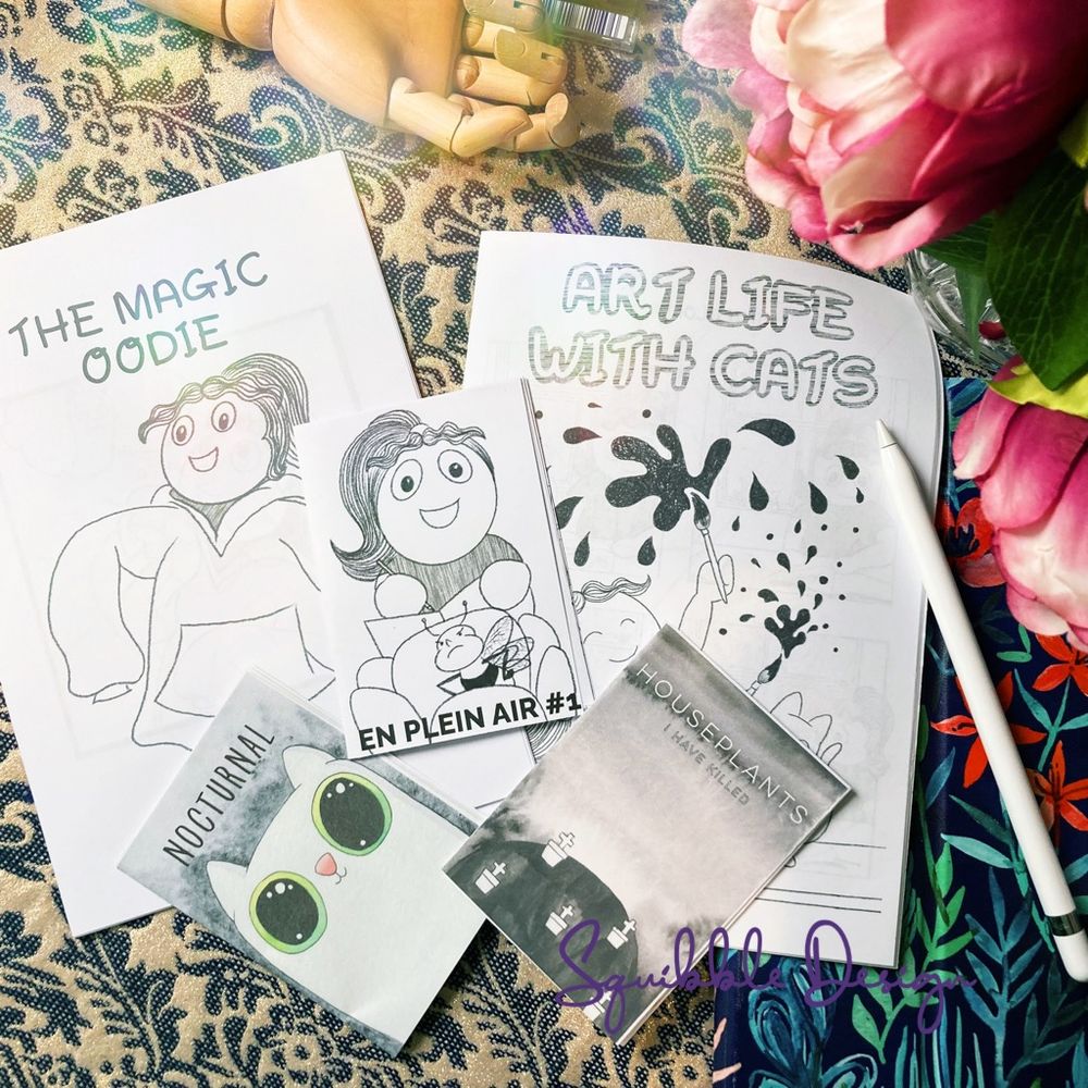 All my current zines on my table next to my iPad!