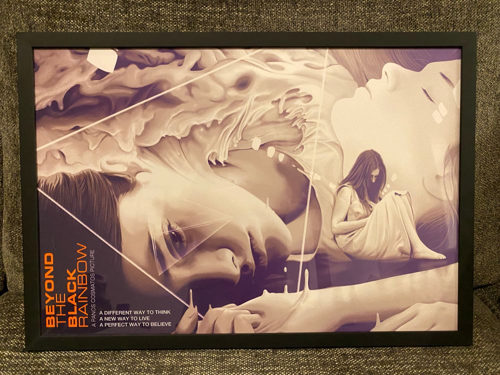 This photo features a framed print of Elena from the movie Beyond the Black Rainbow. It's from the artist Chris Koehler.