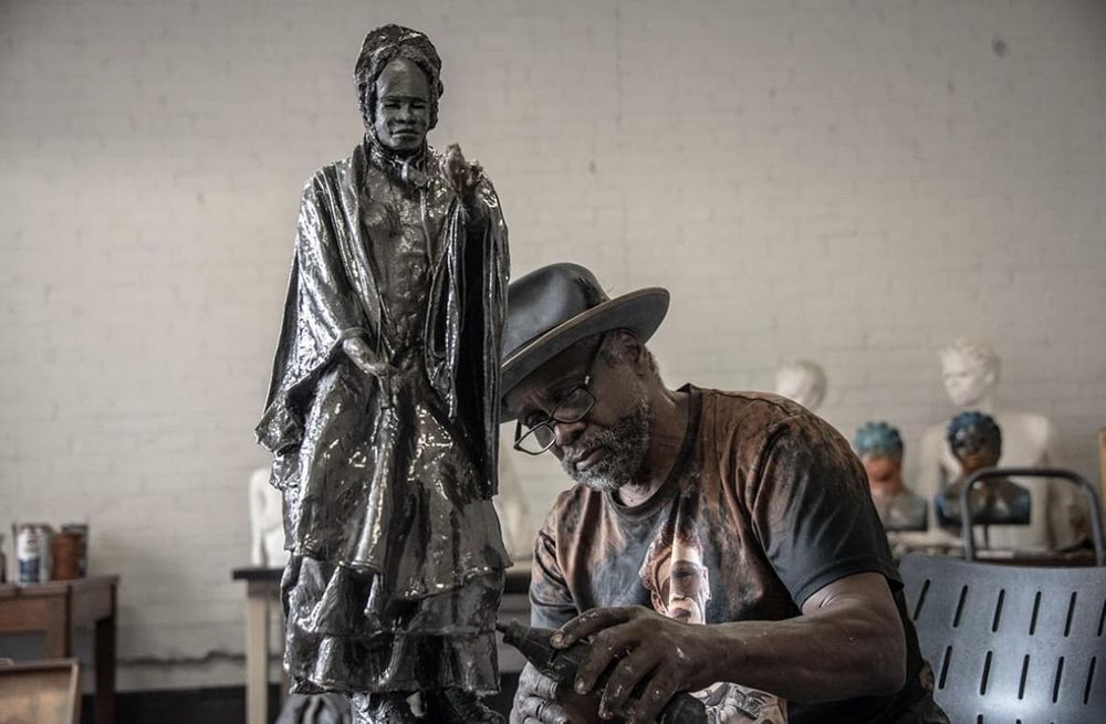 Woodrow Nash working on his sculpture of Sojourner Truth in his studio. 