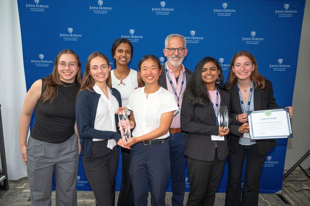 The TriageNow and RescueReady teams holding their awards and posing with Larry Aronhime at HopStart 2025.