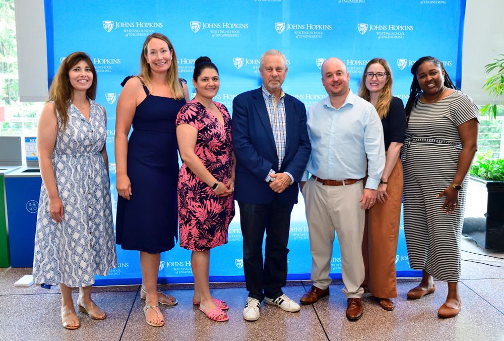 Kim Franklin and other staff members pose with Dean Ed Schlesinger.