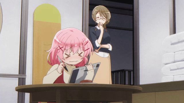 a girl with pink hair is sitting at a table with her eyes closed