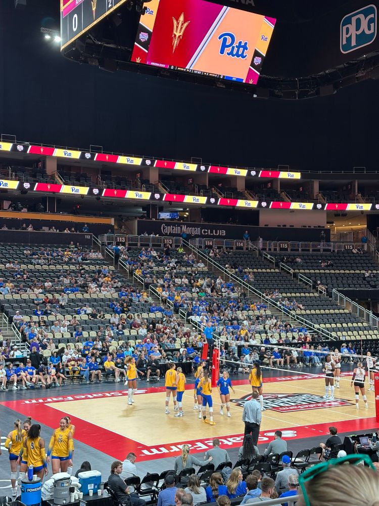 Pregame photo of the two teams on either side of the net at PPG Paints Arena