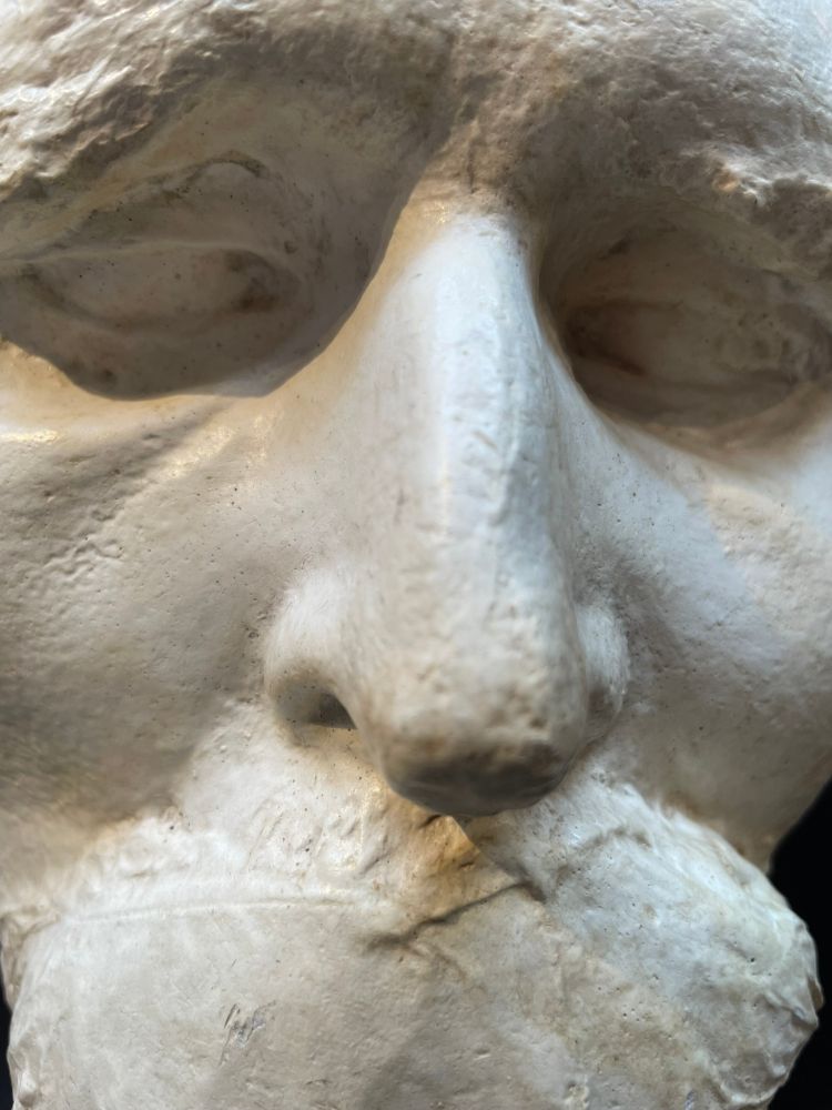 Close up of Friedrich Nietzsche's death mask in grey/white plaster