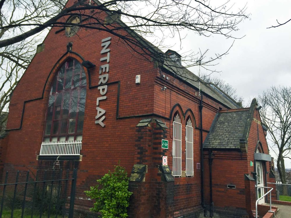 A photo of Interplay, a theatre in a former red brick chapel building