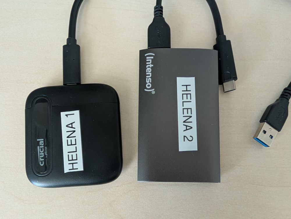 Two hard drives with labels "Helena 1" and "Helena 2".