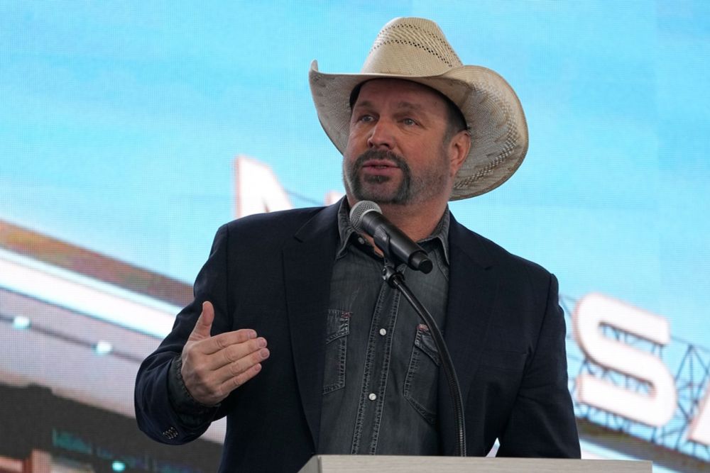 Garth Brooks rape accuser seeks ‘sanctions’ after he names her in court