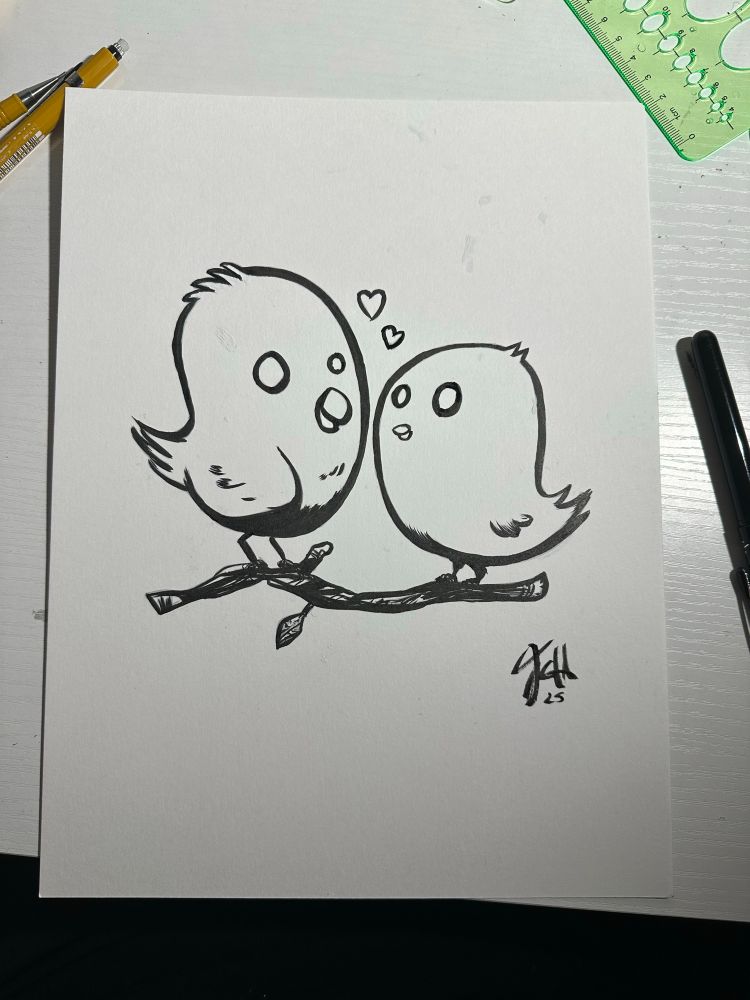 Two black and white Lovebirds share a branch. Two hearts float between them.
