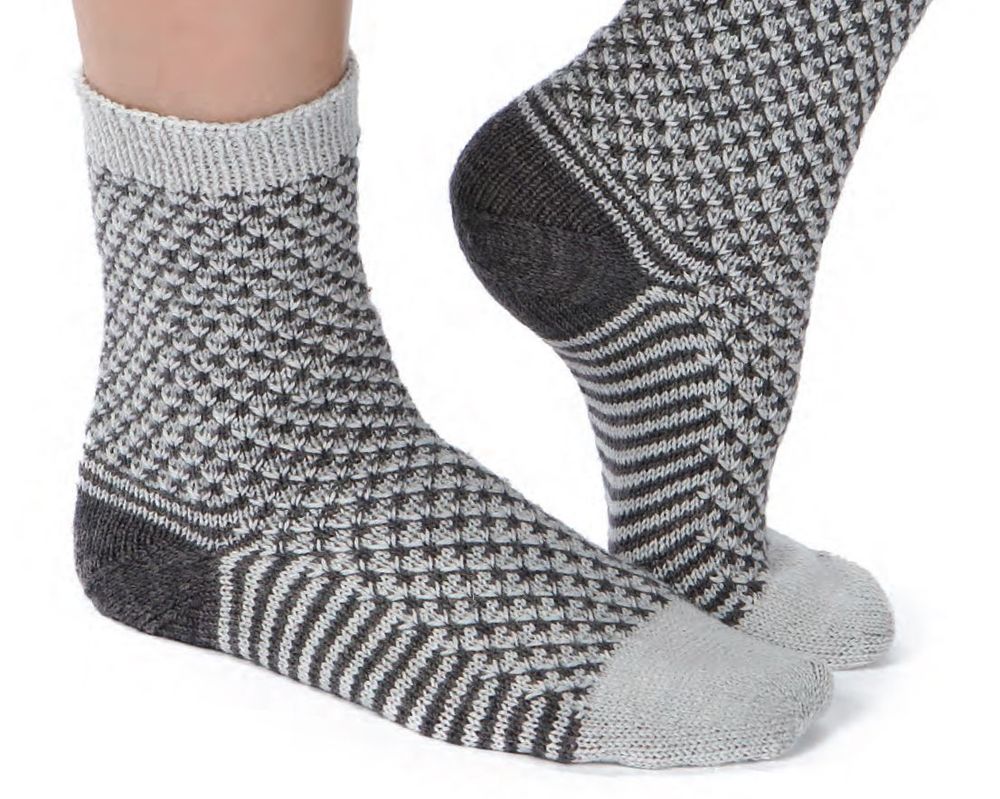 Grey and charcoal socks, with charcoal heels and grey toes and cuffs. Graphite socks, featuring a slipped stitch pattern, available in my Ravelry and PayHip stores.