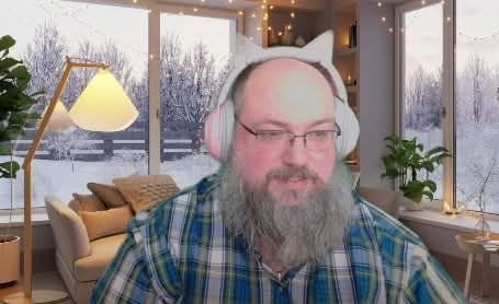 Picture of a funny old guy in a kitty cat RGB headset